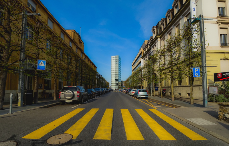 nature, diminishing perspective, road marking, city street, city, car, no people, sign, sky, motor vehicle, pedestrian pathway, architecture, land vehicle