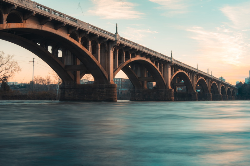 flare, viaduct, brown, light, nature, town, built structure, day, low angle view, city, connection, outdoors, morning, engineering, waterfront, arch, water