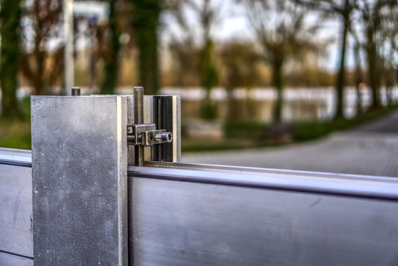 metal, close up, iron, steel, festival, no people, outdoors, demarcation, architecture, wall, mobile wall, mounted, tightness, screw, silver colored, water