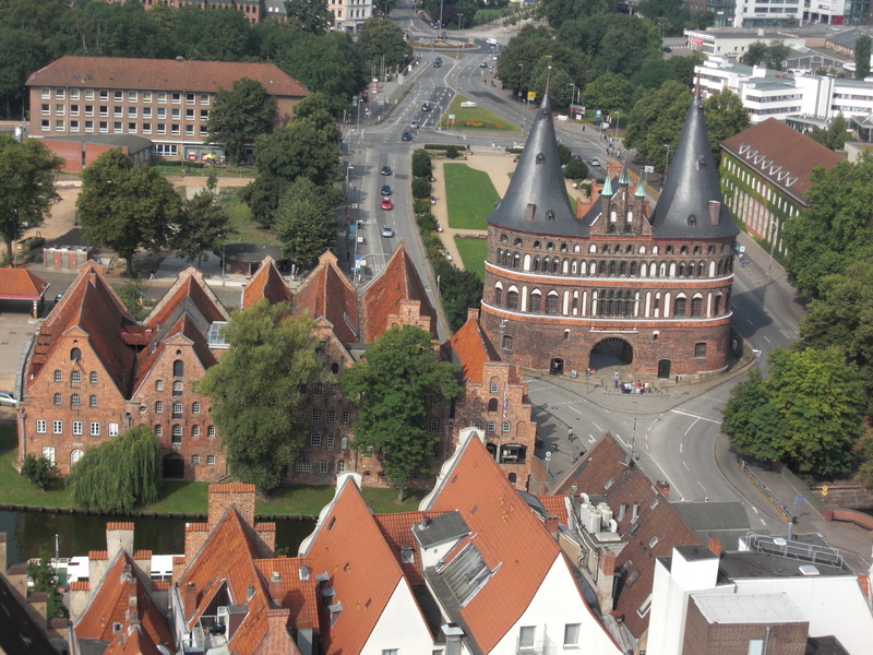 Holsten Gate, tree, city, built structure, nature, outdoors, travel destinations, city gate, house, no people, travel, town, Lübeck, historically, cityscape