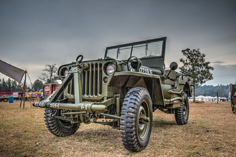 army, land vehicle, no people, stationary, land, mode of transportation, high, nature, day, wheel, field, metal, pick-up truck, plant, truck, outdoors