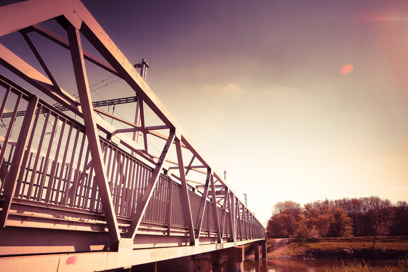 architecture, river, bridge - Man Made Structure, water, rollercoaster, sunset, built structure, nature, amusement park ride, arts culture and entertainment
