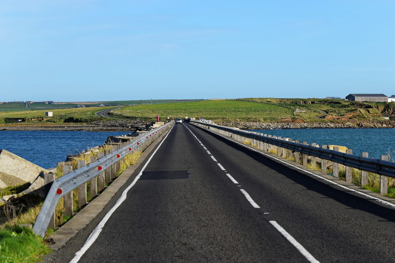 blue sky, road, outdoors, diminishing perspective, Travel, vanishing point, direction, rock, countryside, Sea, green, clear sky, the way forward, environment