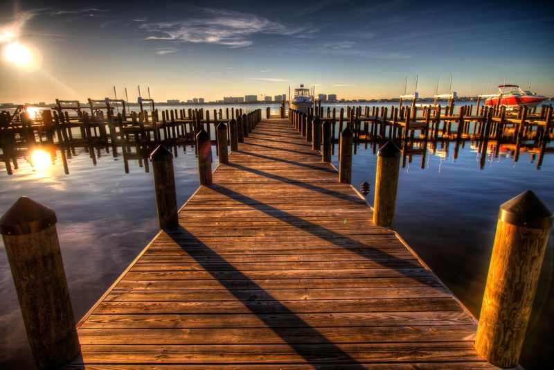 sky, tranquil scene, clouds, reflection, beauty in nature, twilight, wood, sunset, no people, docks, architecture, pier, evening, sun, wooden post, post