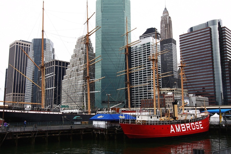 sky, architecture, building, tower, boat, ship, nautical vessel, travel, building exterior, wall, financial district, downtown, cityscape, street, modern