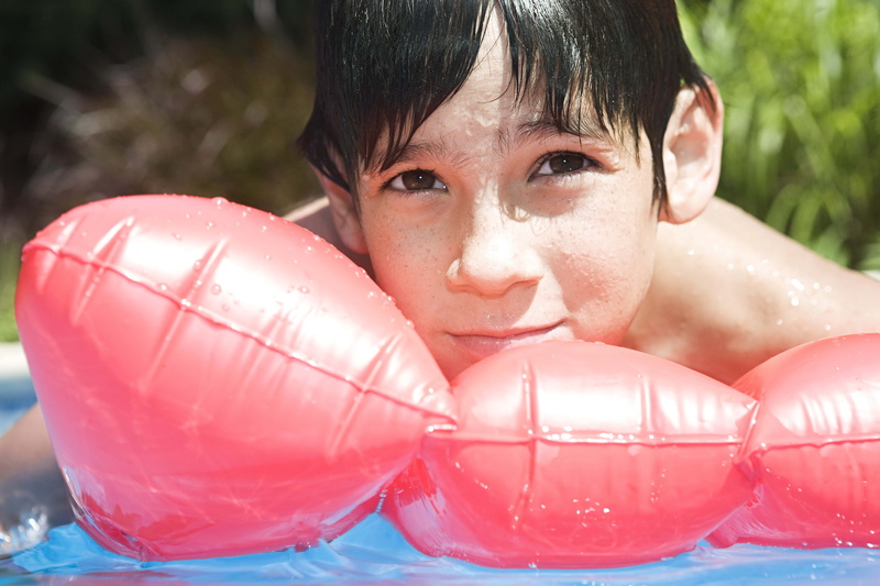one person, buoy, boy, headshot, drops, child, nature, water, looking at camera, close-up, inflatable, real people, lifestyles, childhood, portrait, swimming pool