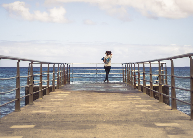 shorts, dock, clothing, standing, port, human, apparel, real people, building, leisure activity, nature, 2K, waterfront, railing, sea, one person, banister