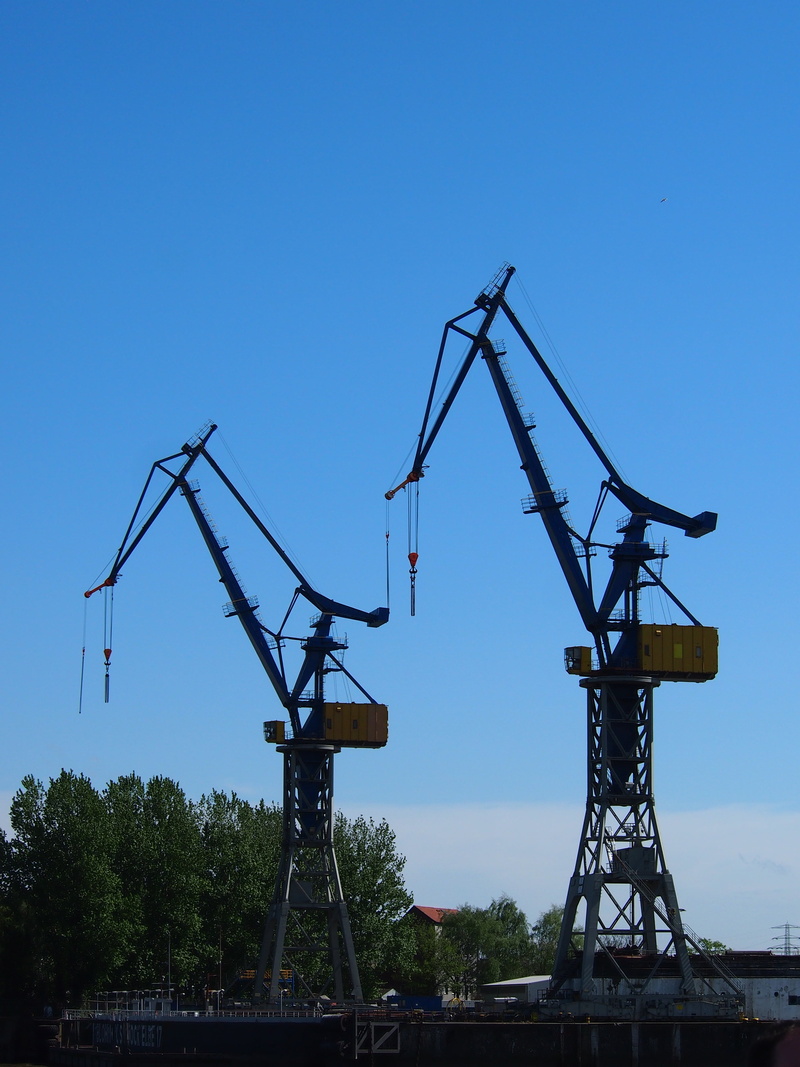 field, outdoors, port, day, crane, nature, germany, construction equipment, industry, oil well, architecture, blue, harbour cranes, metal, development