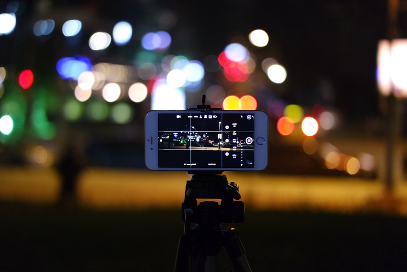 digital camera, phone, focus on foreground, iphoneography, illuminated, home video camera, text, blur, equipment, 5K, connection, camera - photographic equipment