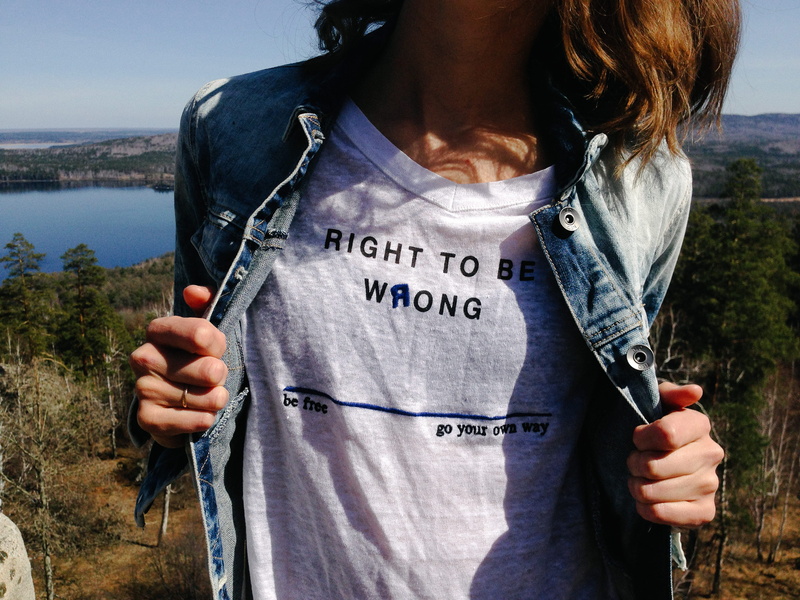 real people, leisure activity, wearing, outdoors, denim, front view, holding, woman, standing, hairstyle, women, lake, tree, communication, jacket, casual clothing