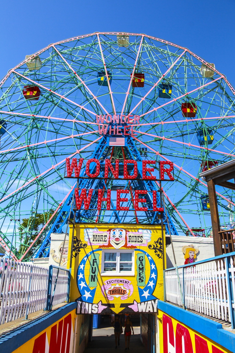 amusement park, blue, text, leisure activity, architecture, travel destinations, built structure, fairground, ferris wheel, coney island, western script