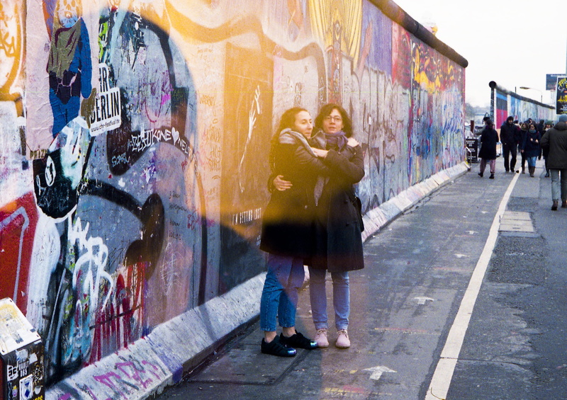 eu, art and craft, paint, side, wall, women, street, real people, mauer, exposure, graffiti, film, double, built structure, germany, lifestyles, group of people