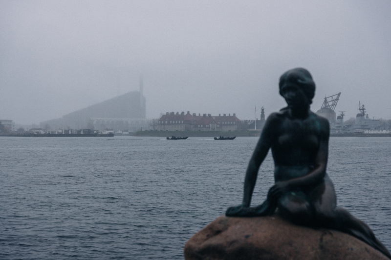 sky, day, sculpture, human representation, sea, building exterior, mermaid, river, art and craft, representation, water, 5K, built structure, fog, architecture