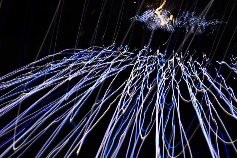 motion, long exposure, streaks, speed, messy, low angle view, 5K, glowing, pattern, light painting, shutter speed, light trail, no people, illuminated