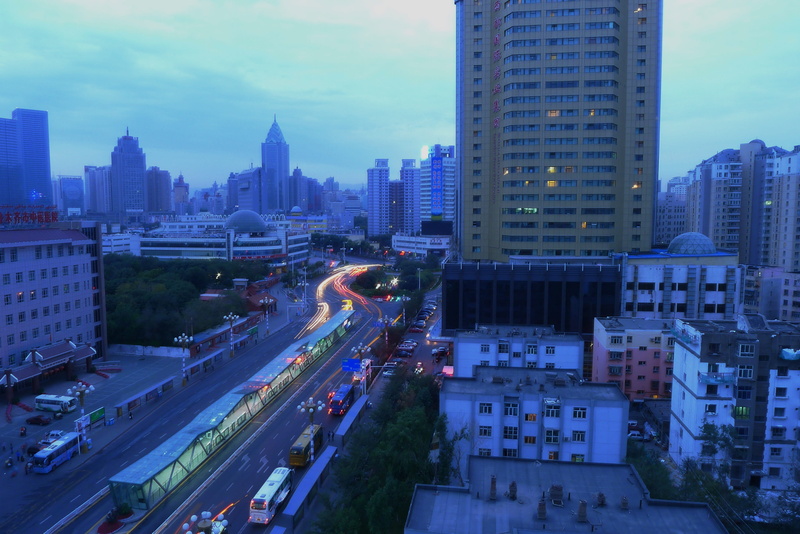 built structure, urumqi, tall - high, city life, sky, transportation, building, office, financial district, traffic light, architecture, early in the morning