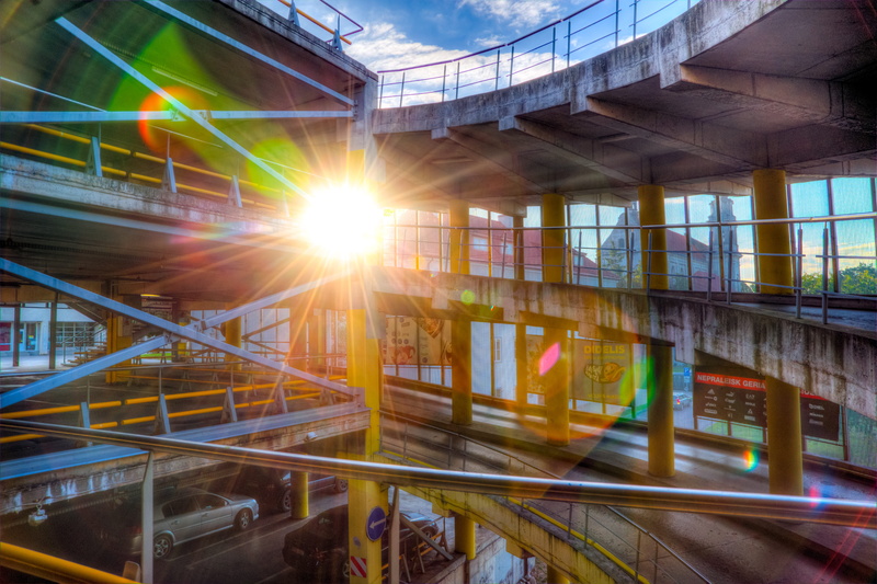 sun, nature, transportation, concrete, building, industry, architectural column, streaming, vehicle, car lot, city, ceiling, bright, mode of transportation