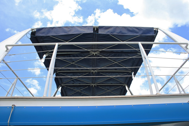 roof, window frame, clouds, directly below, blue, built structure, sky, upper deck, low angle view, restraint, window, building, cloud - sky, reflection