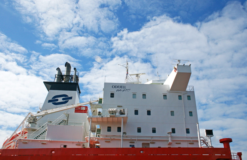 city, in port, cargo, bridge of a ship, cruise ship, upper, red, cruise, low angle view, machinery, blue, structure, architecture, bridge, white color