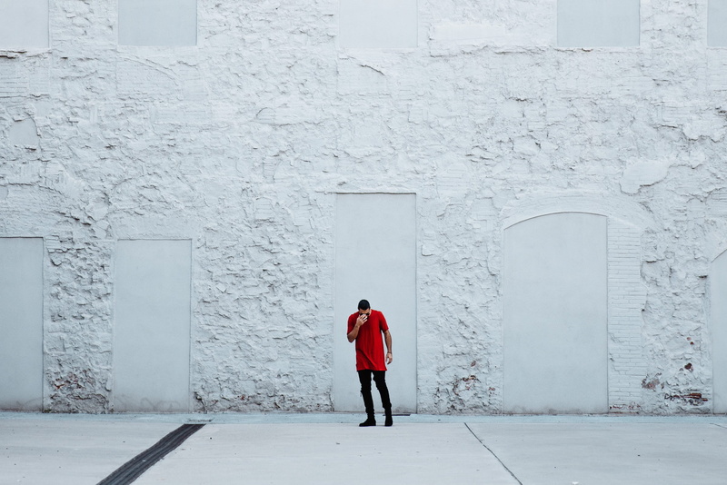 men, architectural column, red, 2K, footwear, textile, person, one person, white color, building, people, expression, warm clothing, casual, sunglasses