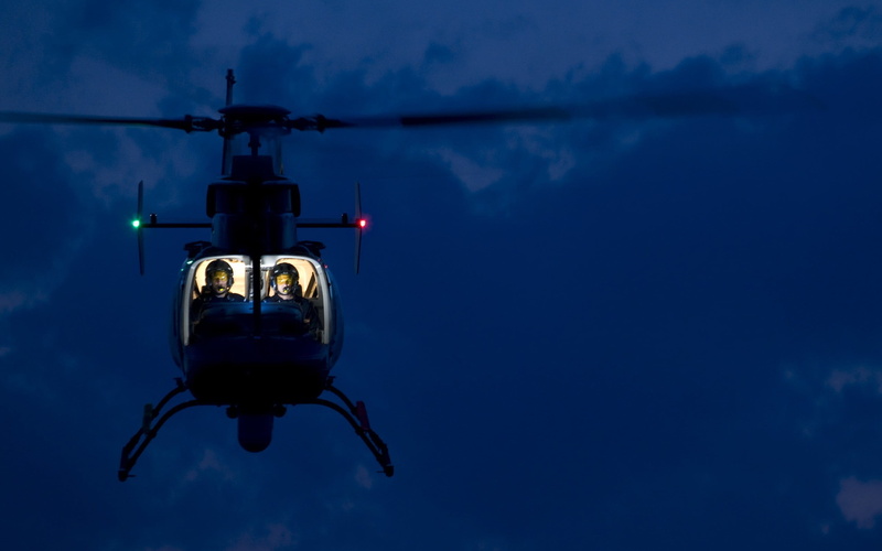 reflection, sign, mode of transportation, nature, helicopters, mid-air, motion, illuminated, blue, no people, flying, night, vehicle, communication, sky