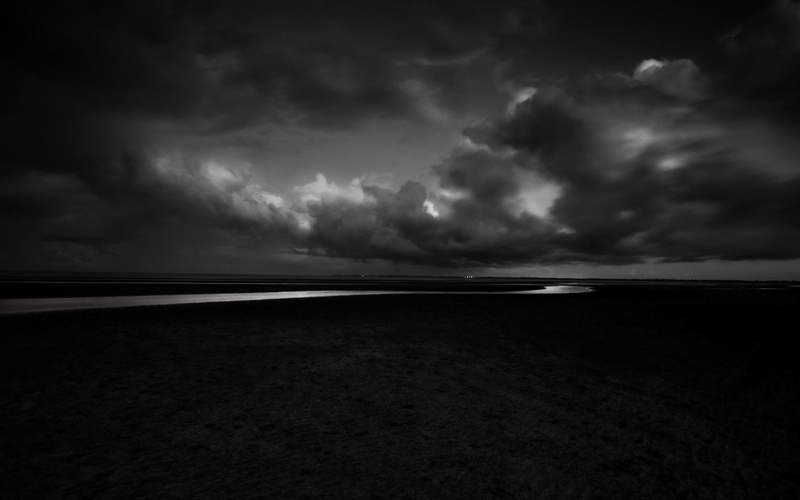 storm, beauty in nature, tranquil scene, no people, beach, cloud - sky, tranquility, dark, dramatic sky, monochrome, overcast, scenics - nature, clouds