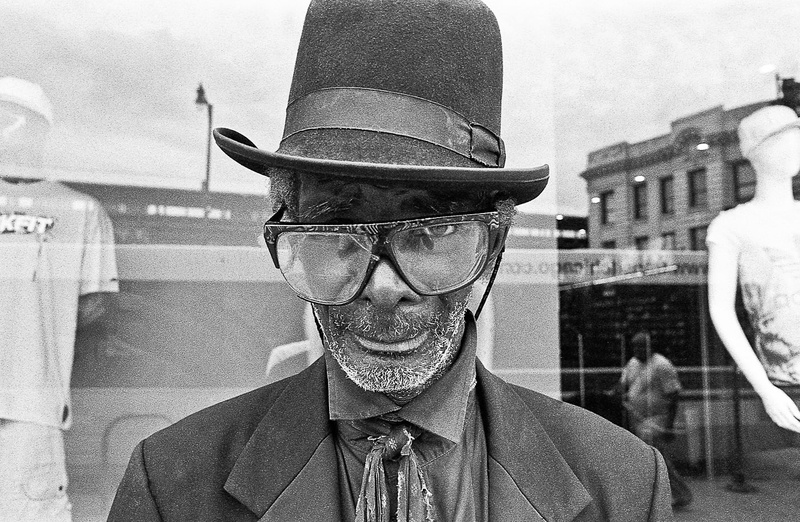 monochrome, hat, business, menswear, built structure, 720P, adult, occupation, fashion, clothing, portrait, front view, reflection, men, obscured face