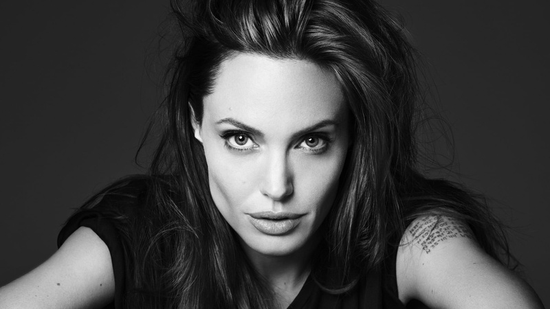juicy lips, black background, face, actress, looking at camera, hairstyle, close-up, long hair, one person, headshot, studio shot, hair, human face, beauty