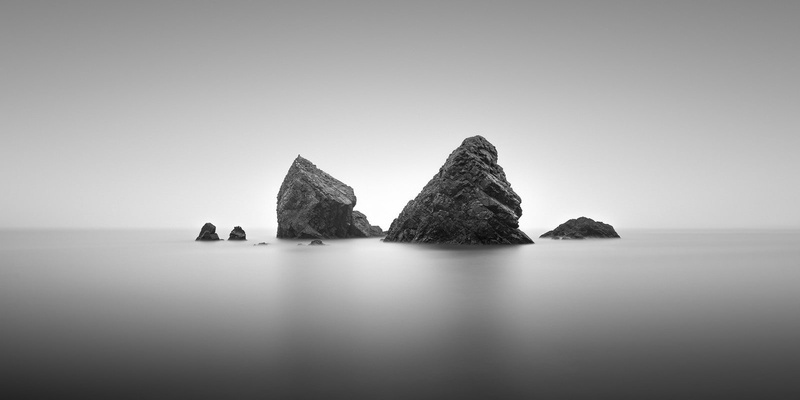 nature, rock formation, no people, monochrome, horizon over water, solid, scenics - nature, sea, tranquil scene, beauty in nature, stack rock, clear sky