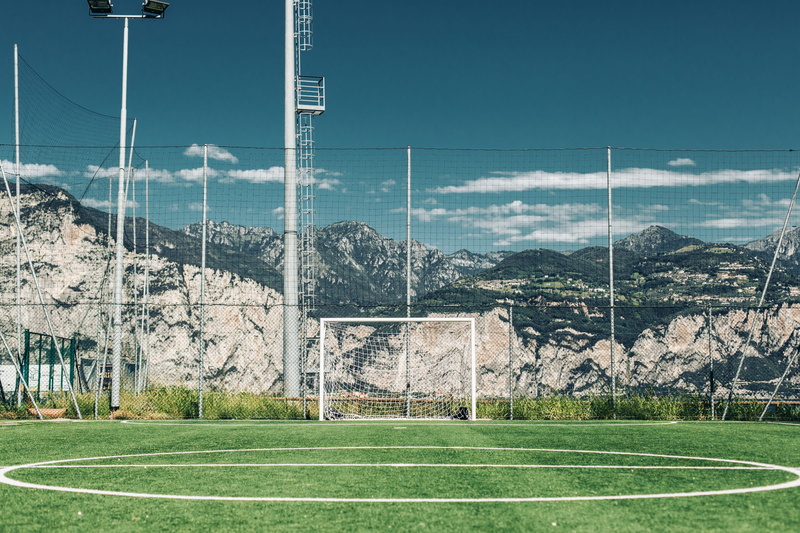 no people, plant, white line, soccer, team sport, day, grass, pitch, football, sunny, soccer field, playing field, architecture, floodlight