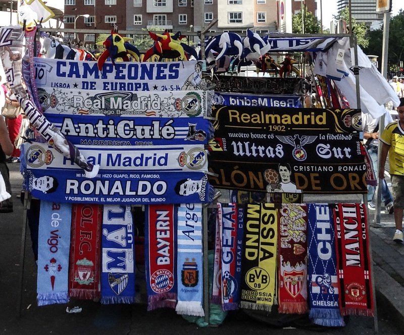 communication, real madrid, advertisement, display, non-western script, choice, built structure, stadium, fan, sign, large group of objects, assorted, outdoors