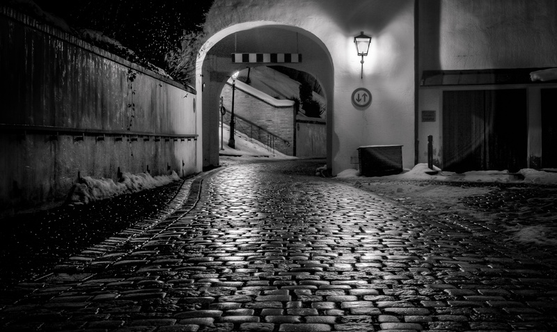 graffiti, street, direction, footpath, text, snow, europe, evening, lamp, winter, old, lantern, building exterior, alley, scene, grayscale, absence, city