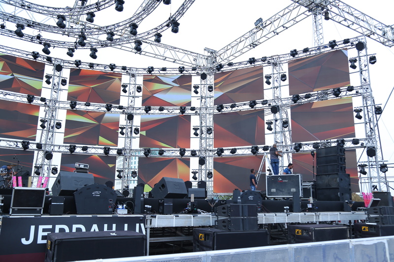 theatrical performance, live event, floodlight, electric lamp, electricity, arts culture and entertainment, stage theater, sky, day, sign, music festival