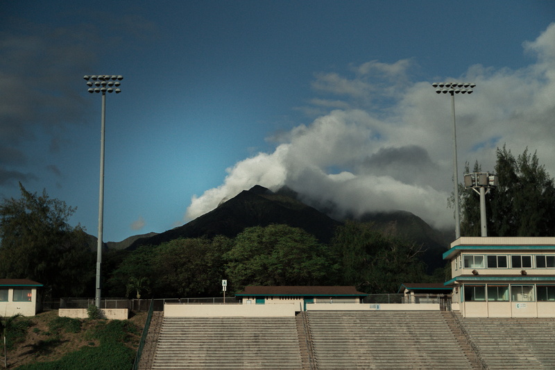 outdoors, mountain, built structure, transportation, cloud - sky, sky, building exterior, 5K, floodlight, foliage, sport, football, blowing, field, daytime