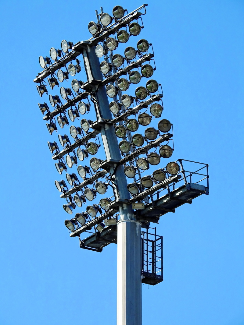 communication, low angle view, clear sky, 4K, pole, sunlight, track, nature, floodlight, outdoors, power supply, steel, sky, sign, spotlights, architecture