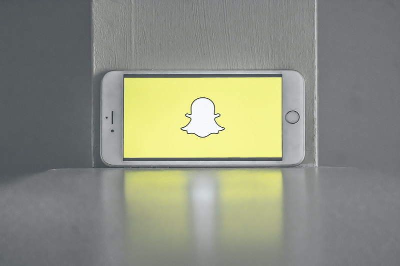 information, door, indoors, logo, social media, public restroom, internet, public building, wall - building feature, human representation, snapchat, snapshot