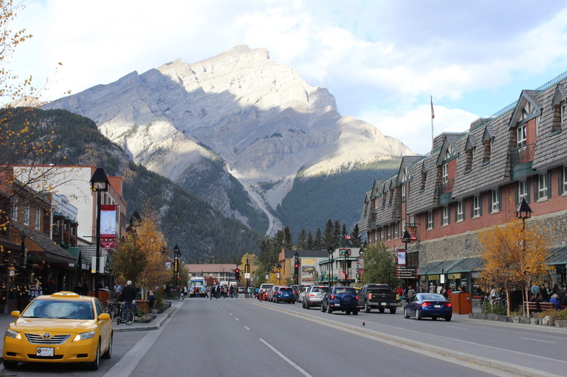 mode of transportation, mountain range, transportation, cloud - sky, snowcapped mountain, 2K, motor vehicle, infrastructure, built structure, road, outdoors
