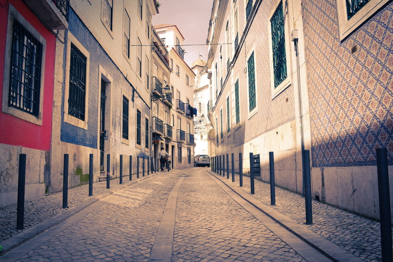 city, cityscape, architecture, outdoors, lane, building exterior, sidewalk, color, town, building, street, direction, neighbourhood, infrastructure, residential district