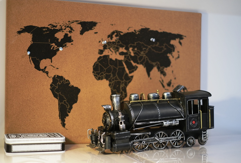 wall - building feature, train, music, close-up, equipment, focus on foreground, still life, no people, large group of objects, map, world map, technology