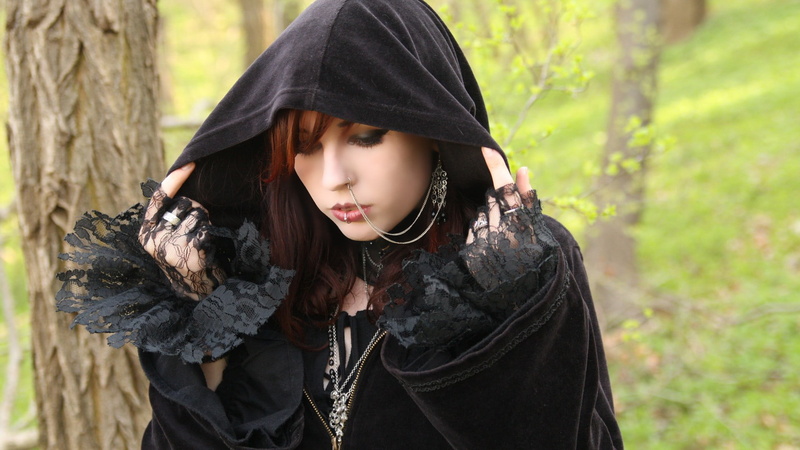 waist up, land, plant, hairstyle, lifestyles, clothing, women, standing, piercing, forest, women outdoors, holding, outdoors, one person, hood, nose rings