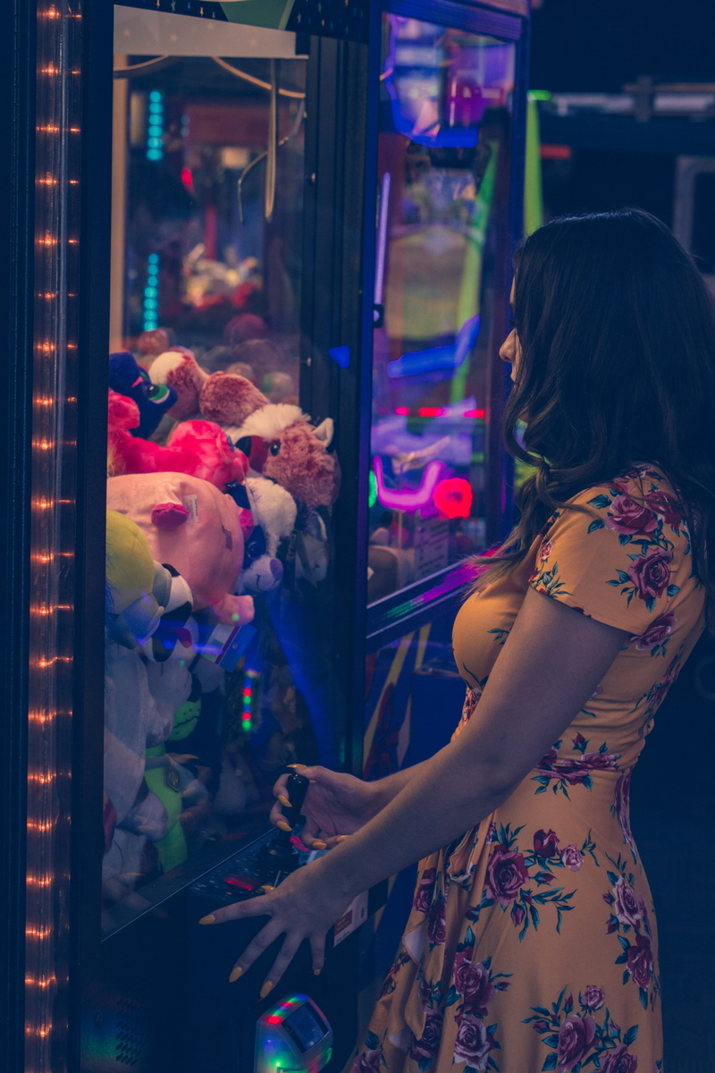 portrait, wind, females, light, young Adult, vertical, teen, toy, prize, people, indoors, beautiful, machine, fashion, playing, cute, lifestyles, women