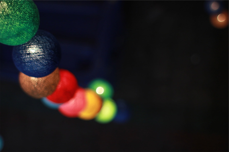 twine, still life, hanging, black background, spheres, green color, selective focus, christmas, marbles, arts culture and entertainment, blurry, group of objects