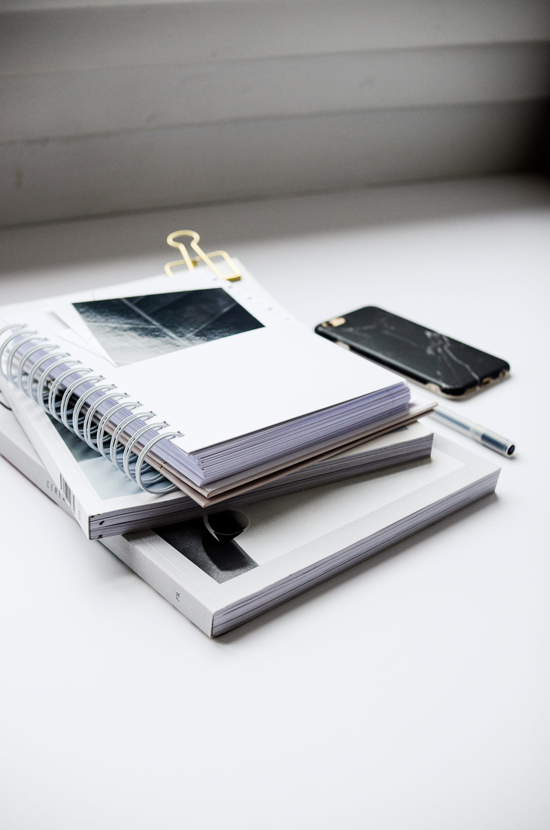 ballpoint, office, phone, publication, books, spiral, communication, no people, personal accessory, high angle view, smart phone, connection, case, mobile phone
