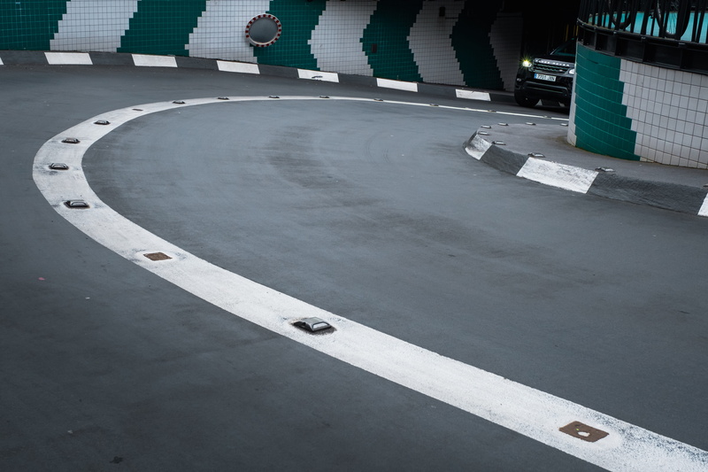 pavement marking, line, day, sign, dividing line, stadium, road, symbol, asphalt, urban, cement, ramp, rotterdam, city, vehicle, white, traveling, car