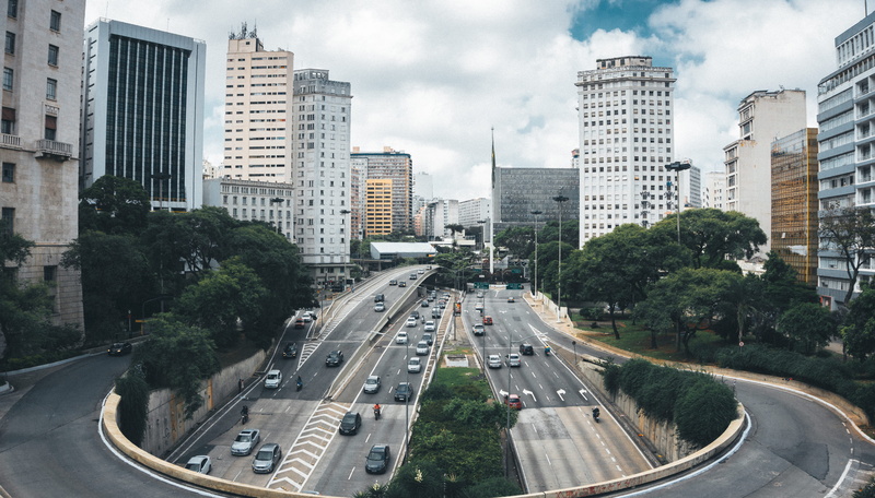 aerial, land vehicle, car, underpass, traffic, sky, architecture, road, business, plant, street, building exterior, highway, built structure, daylight