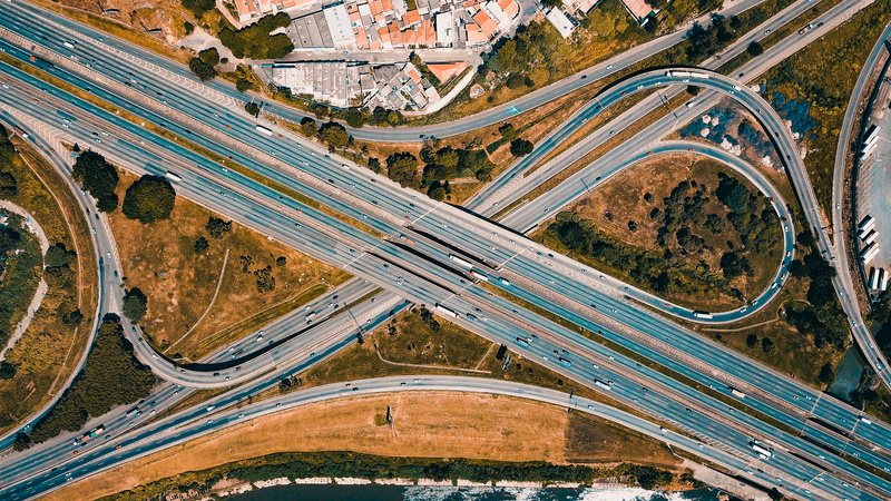 transportation, cars, cityscape, highway, connection, elevated road, vehicles, city, multiple lane highway, aerial view, motion, high angle shot, architecture