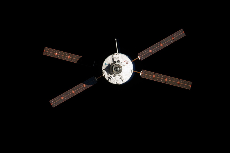 black background, night, directly below, clock, space agency, single object, silver colored, shape, design, architecture, pattern, automated transfer vehicle