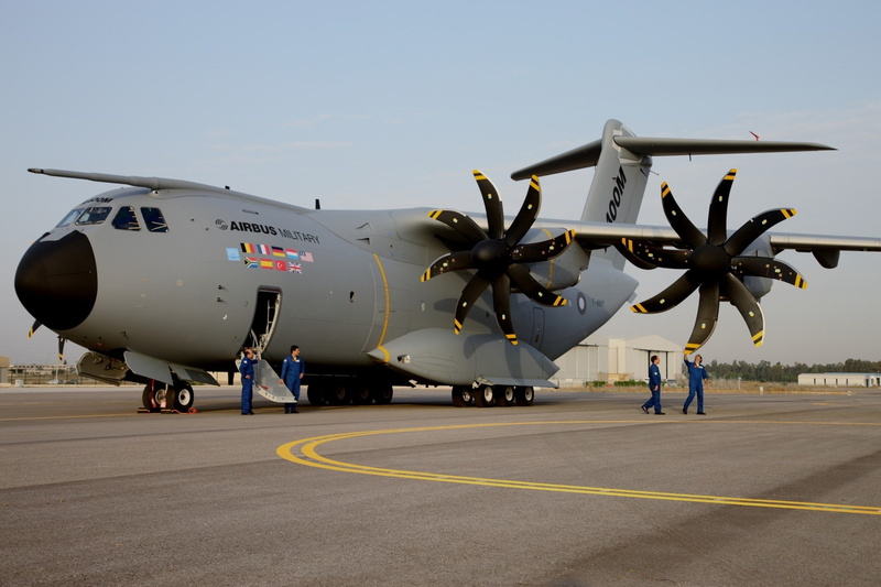 air vehicle, aerospace industry, military, propeller, sky, motion, airport, full length, mode of transportation, incidental people, two people, aircraft airbus a400m atlas airbus military military aircraft