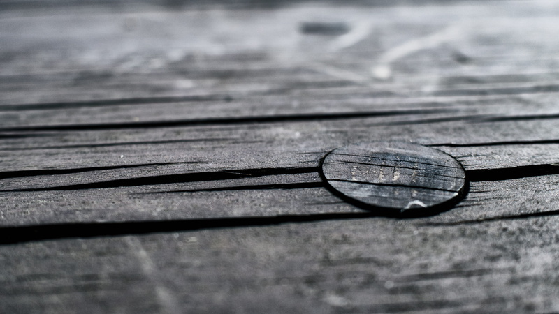 selective focus, day, shape, indoors, texture, wood, sunlight, textured, blackwhite, shadow, eyesight, eyeglasses, no people, close-up, table, still life