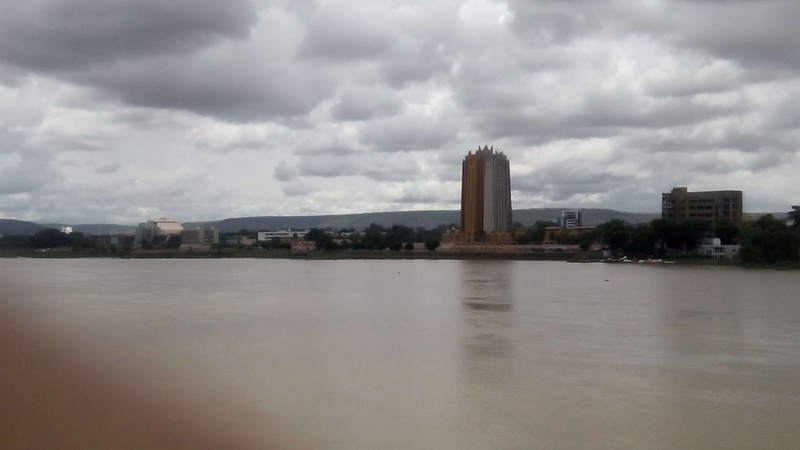 outdoors, no people, skyscraper, day, overcast, bamako, sky, building, building exterior, nature, architecture, environment, city, water, cityscape, cloud - sky
