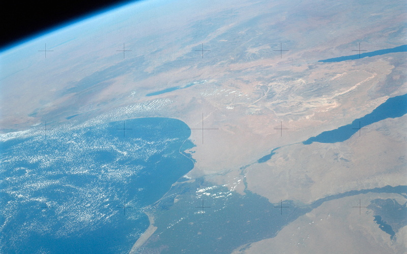 land, beauty in nature, flying, no people, tranquil scene, earth, cold temperature, nature, aerial view, outdoors, tranquility, sea, landscape, scenics - nature